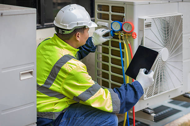 Professional Ac Installation technician working in Weaver, AL